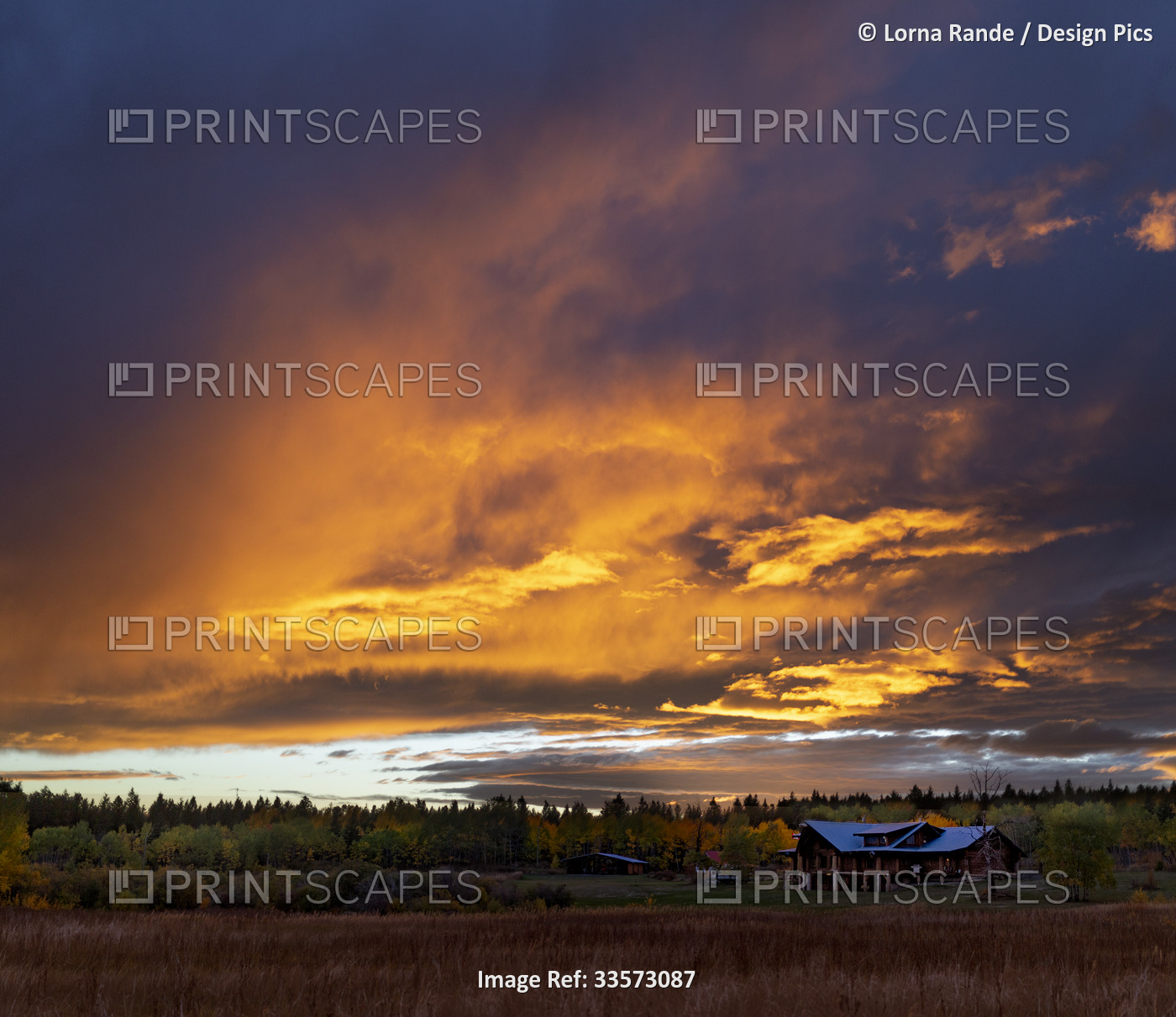 Dramatic sunset sky over Lac La Hache in autumn in beautiful British Columbia, ...