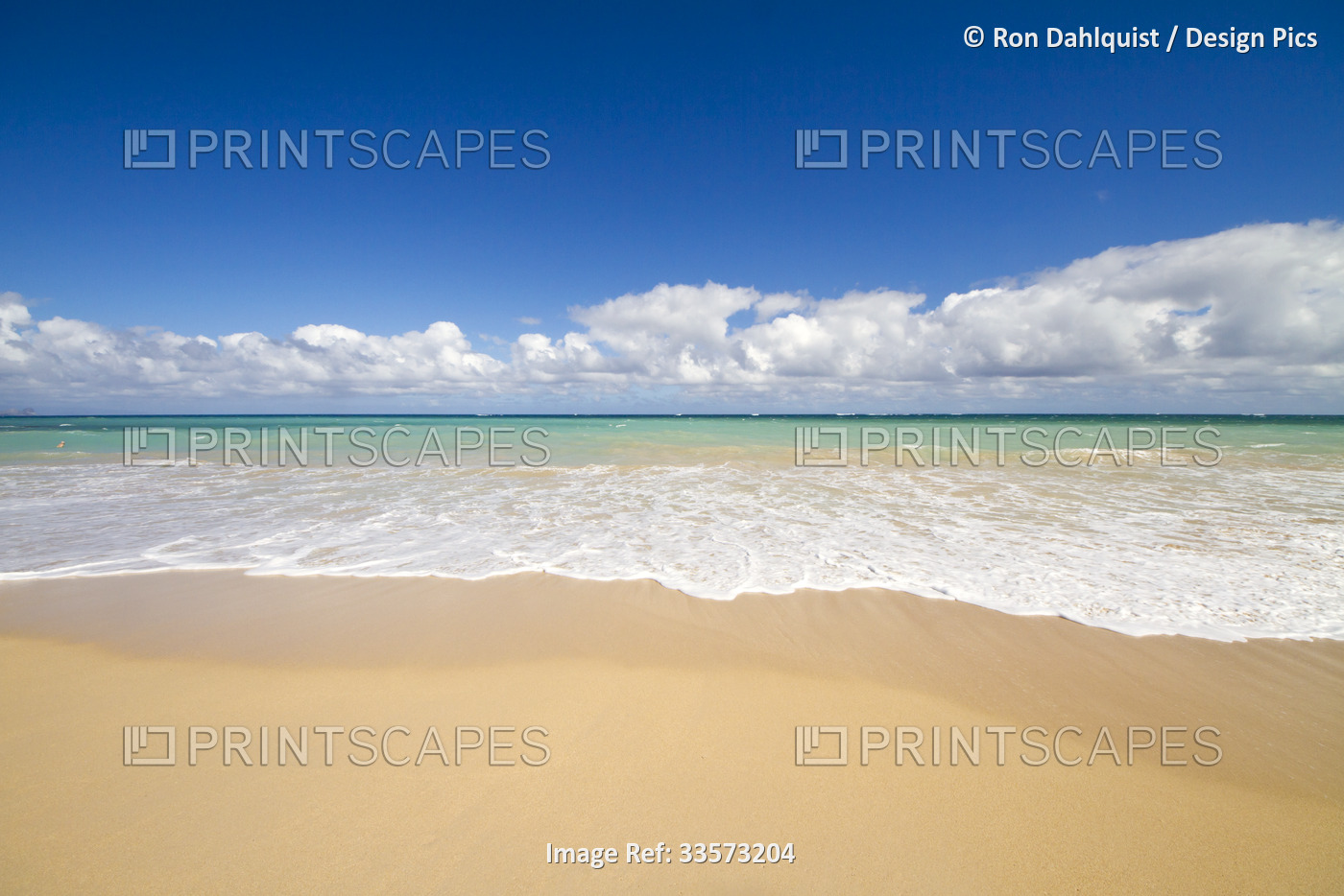 Surf, sand and blue sky at Baldwin Beach on the north shore of Maui near Paia; ...