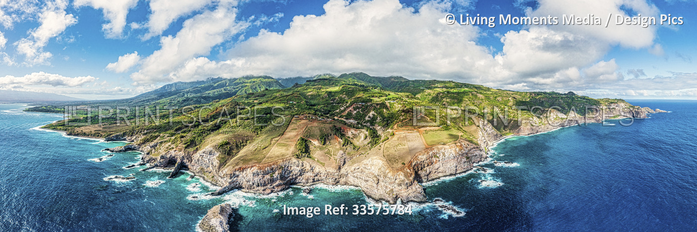 Wide view from a drone perspective of the West Maui Mountains and the coastline ...