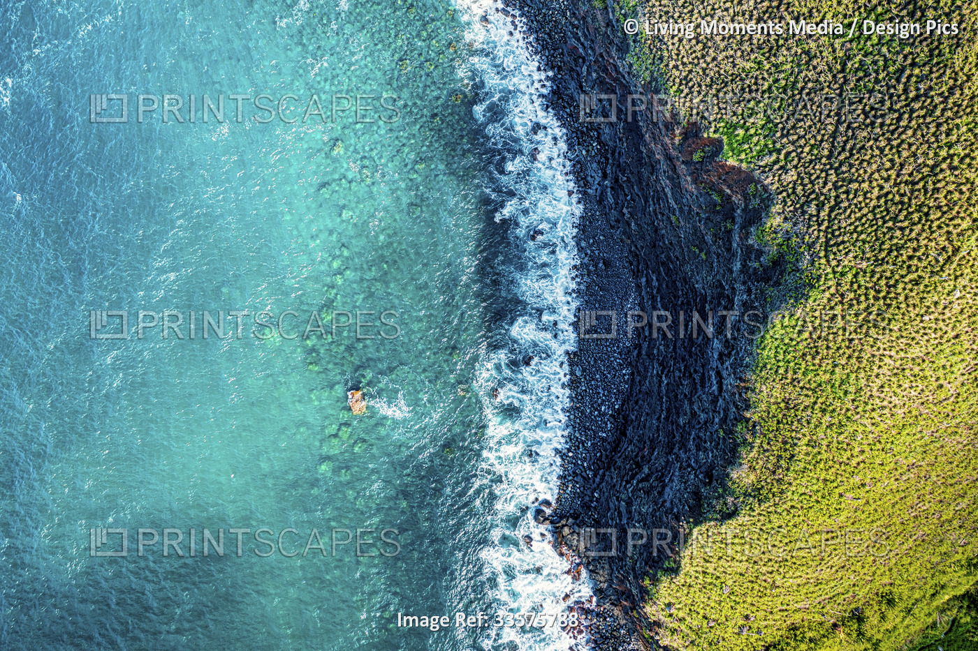View from directly above of the coastline of the island of Maui with green ...