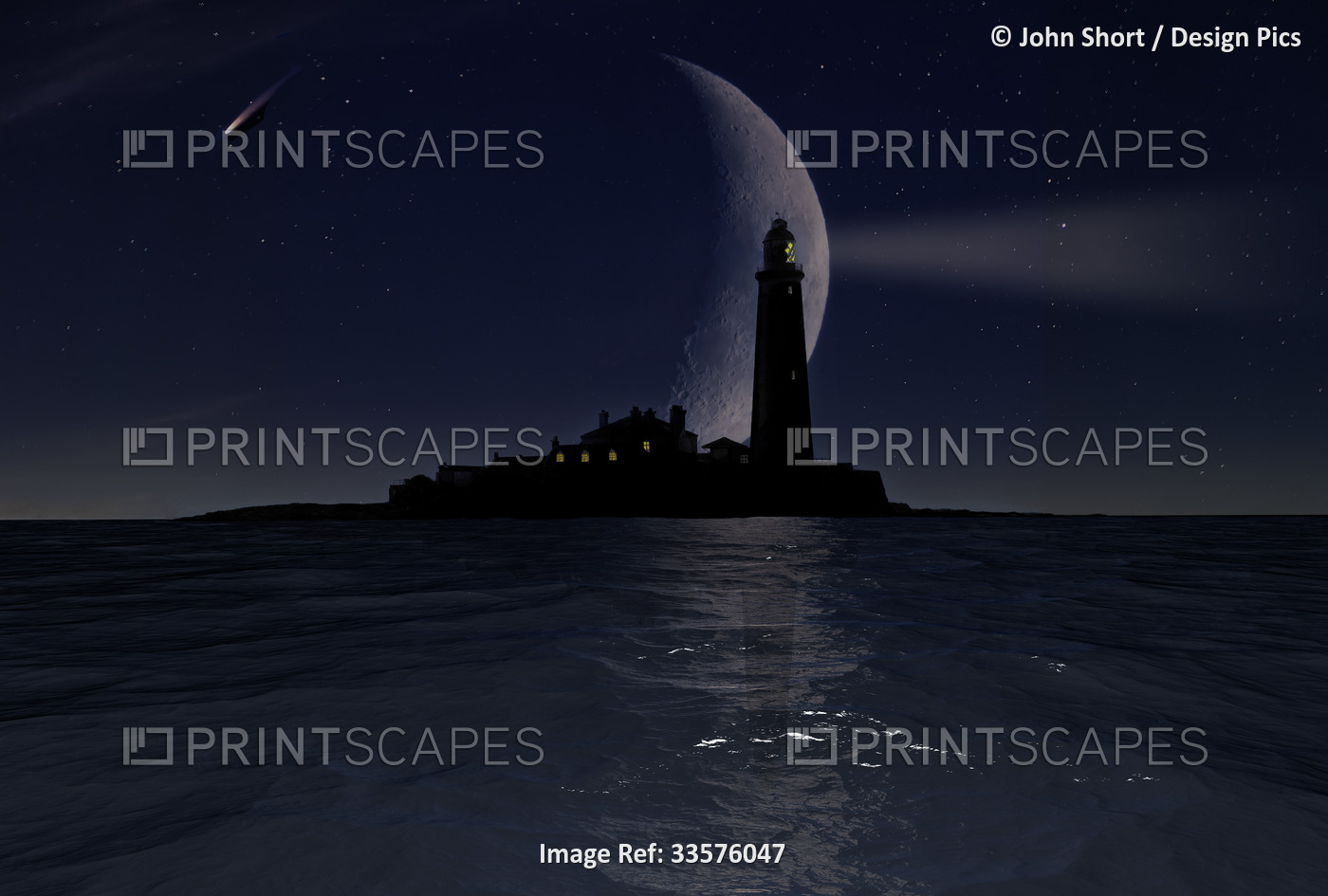 Dramatic moon behind St. Mary's Island Lighthouse illuminated at night on ...