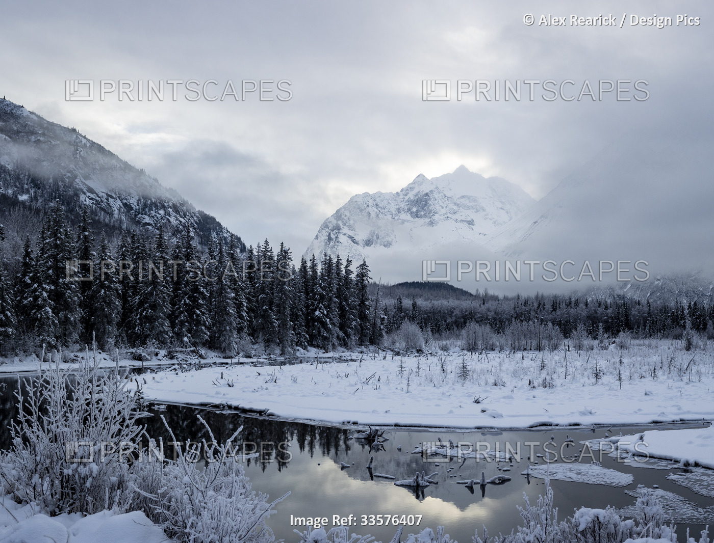 Snow covers the mountainous and forested landscape in Chugach State Park; Eagle ...