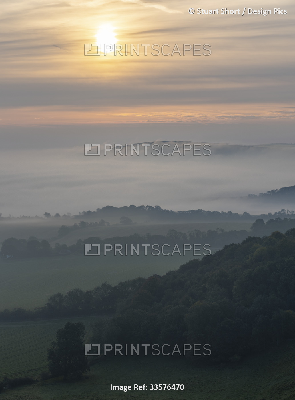 Bank of fog flows over the Long Man of Wilmington in the South Downs National ...