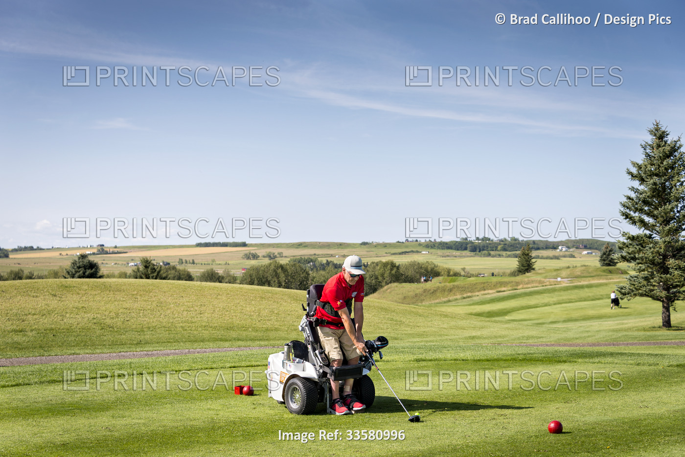 Disabled golfer using a specialized golf assistance motorized hydraulic ...