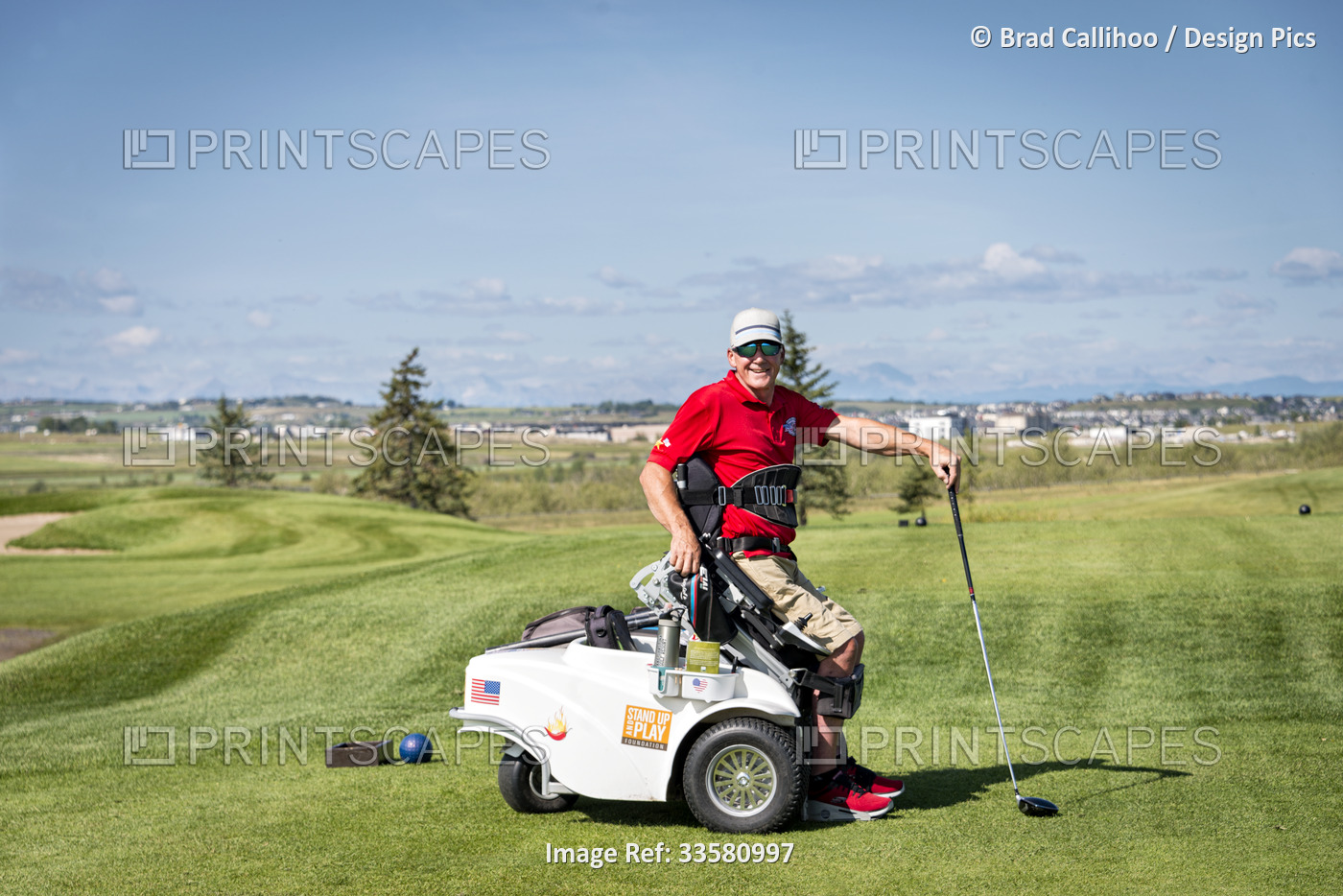 Disabled golfer using a specialized golf assistance motorized hydraulic ...