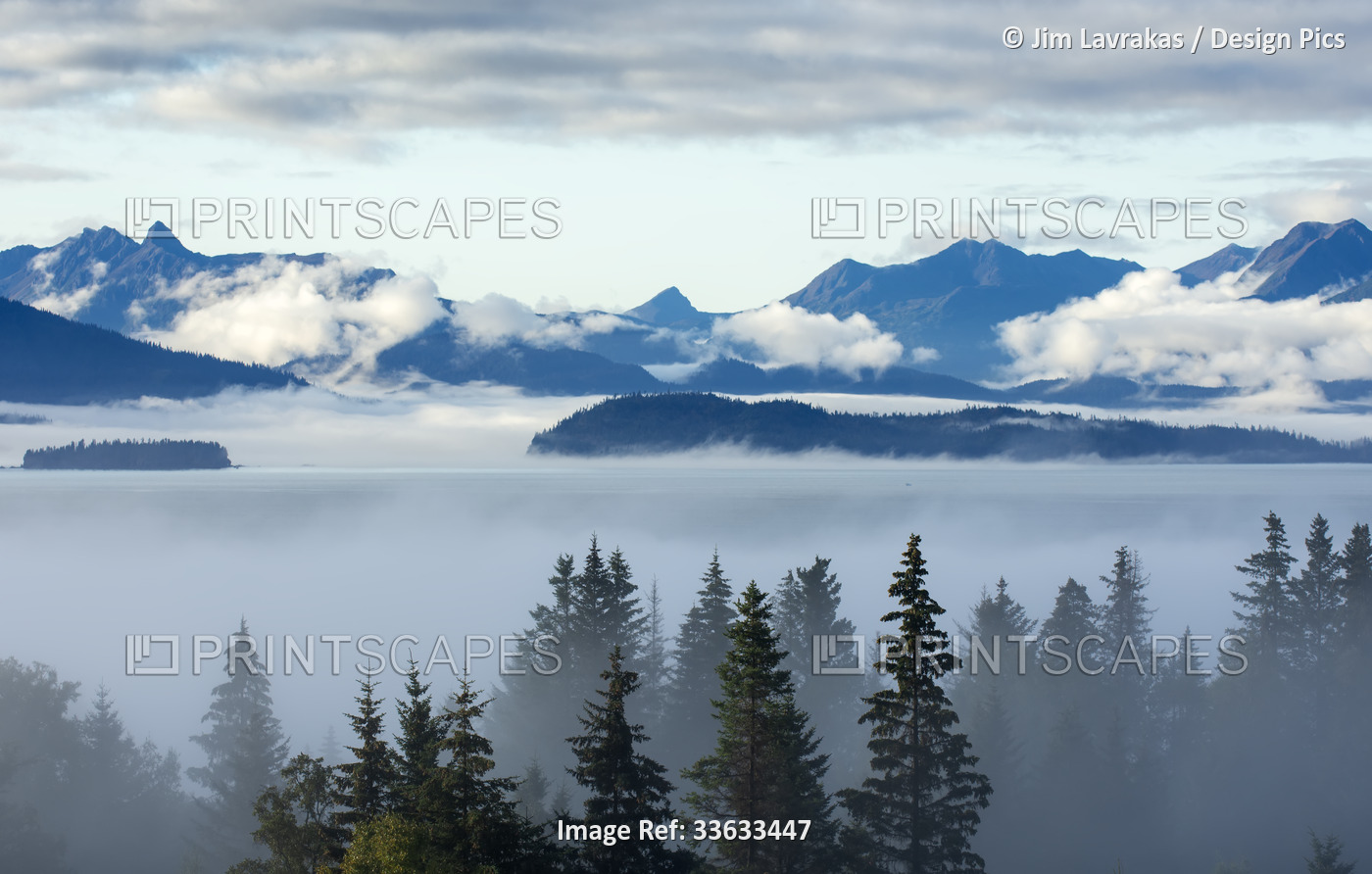 A foggy day slowly reveals Kachemak Bay, the Kenai Mountains, Cohen and Yukon ...