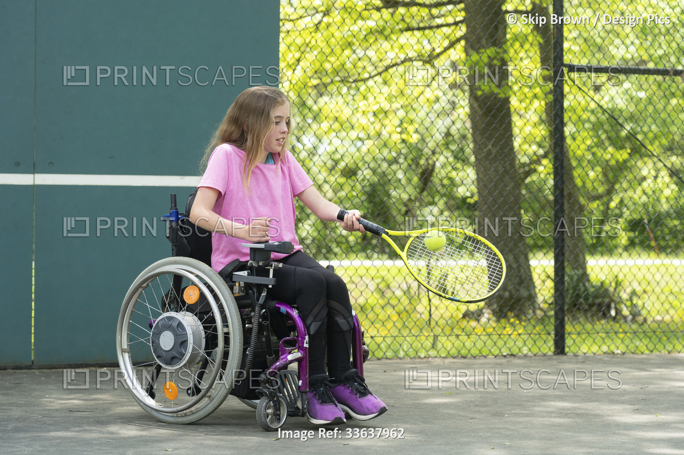Girl with Ullrich Congenital Muscular Dystrophy plays tennis in her wheelchair; ...