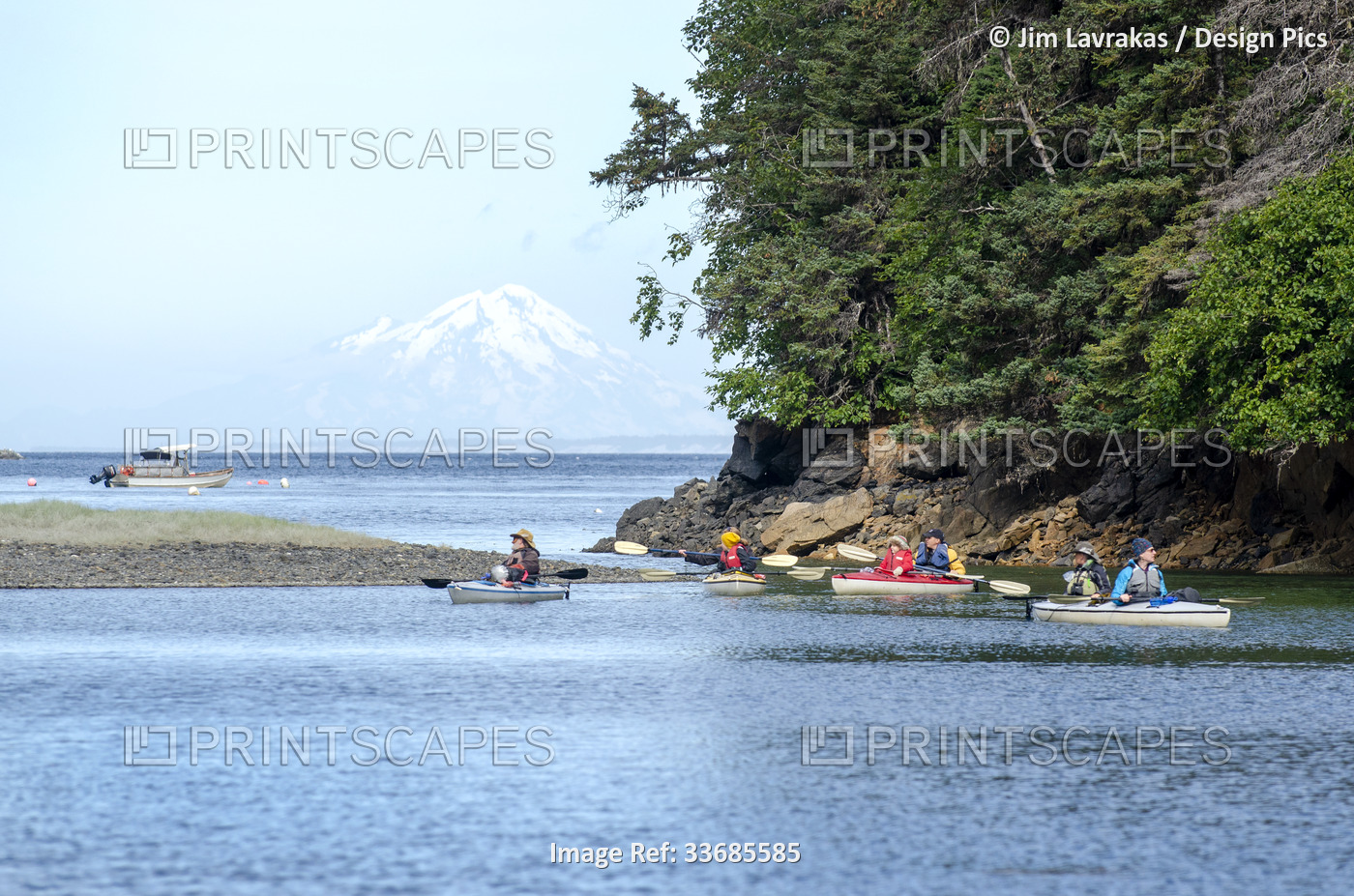 Kayakers paddle through a lagoon in Little Tutka Bay, in Kachemak Bay,  with ...