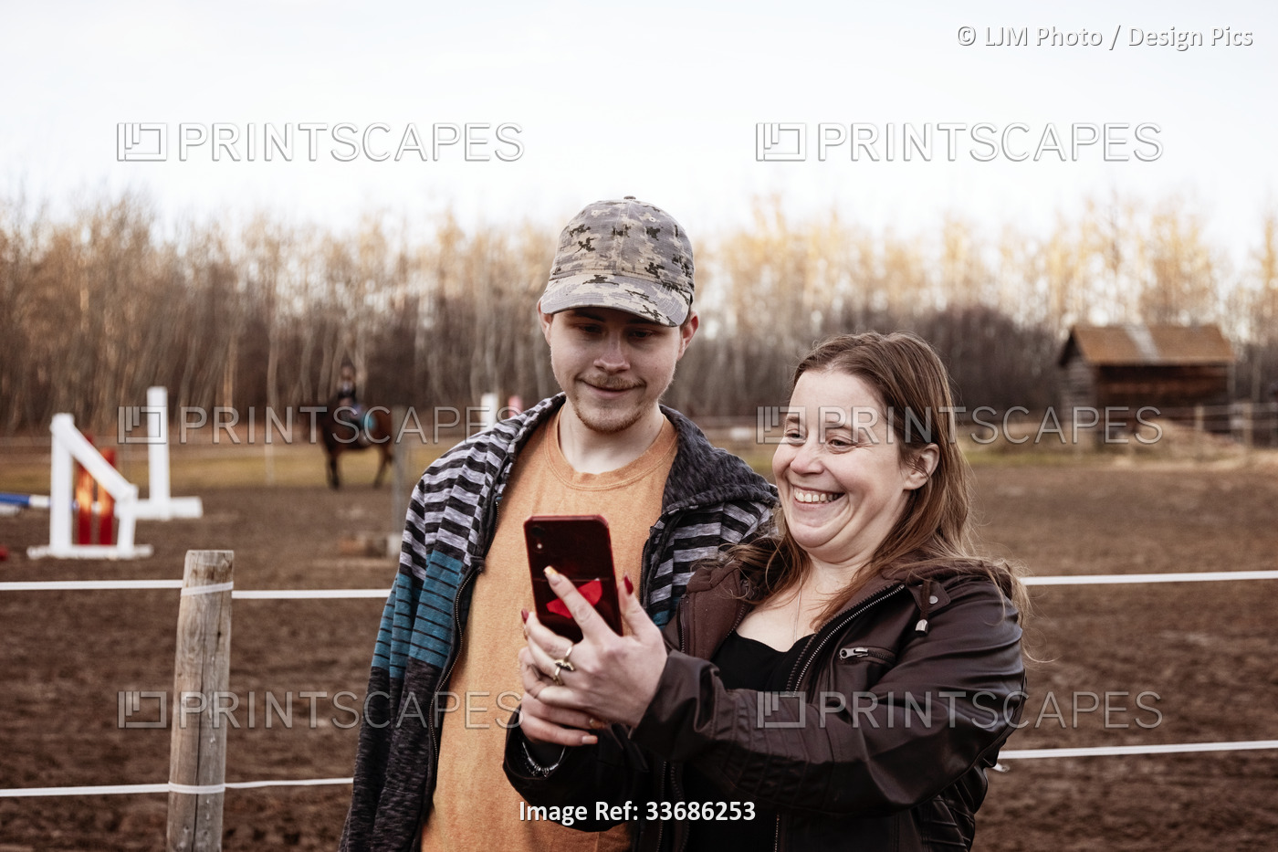 A mom with epilepsy taking a self-portrait with her son who has Aspberger ...