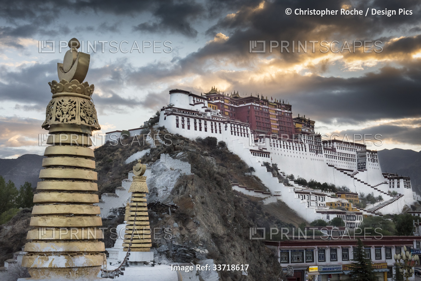 Potala Palace with stupas in foreground at sunrise; Lhasa, Tibetan Autonomous ...