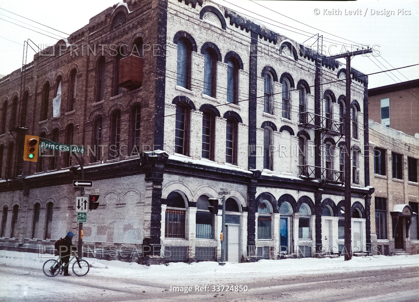 Cyclist and Bathgate Block (242 Princess Street) in Winnipeg, circa 1950's; ...