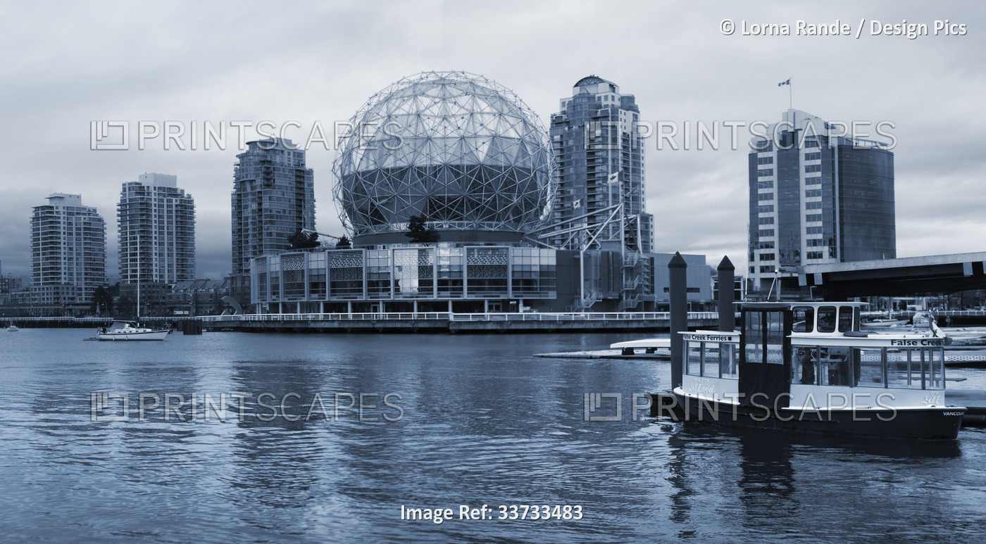 Black and white image of Science World and Oympic Village along False Creek, ...