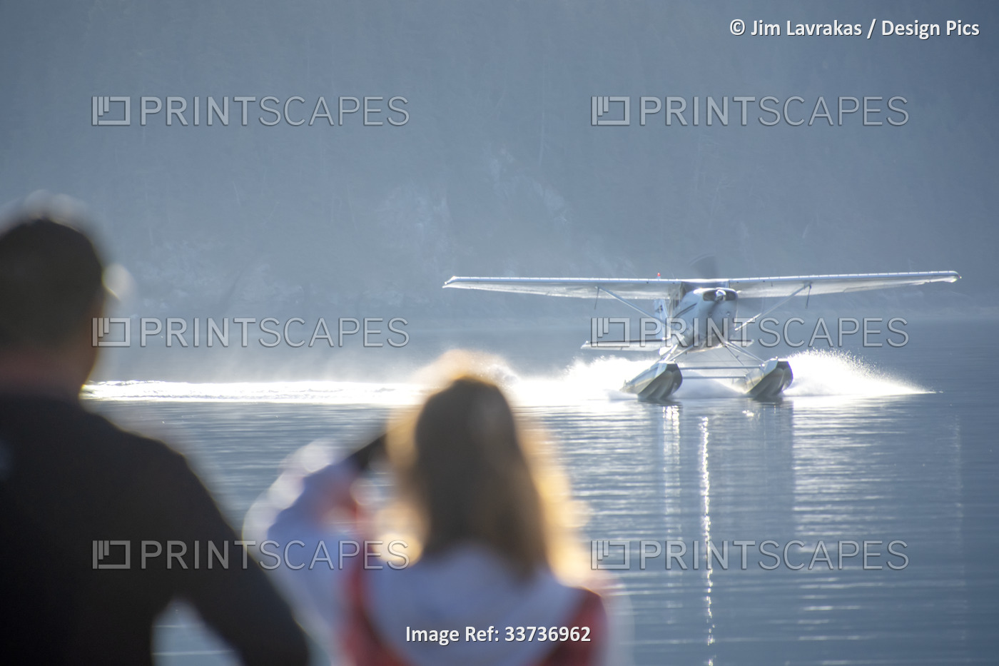Guests at a lodge in Kachemak Bay wait for the arrival of a float plane to take ...