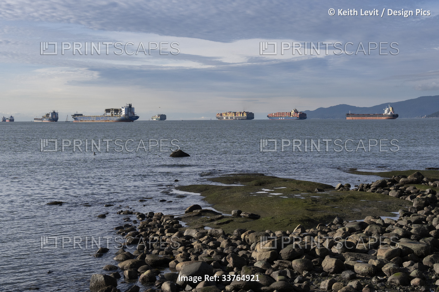 Cargo ships moored off the coast of Vancouver, BC; Vancouver, British Columbia, ...