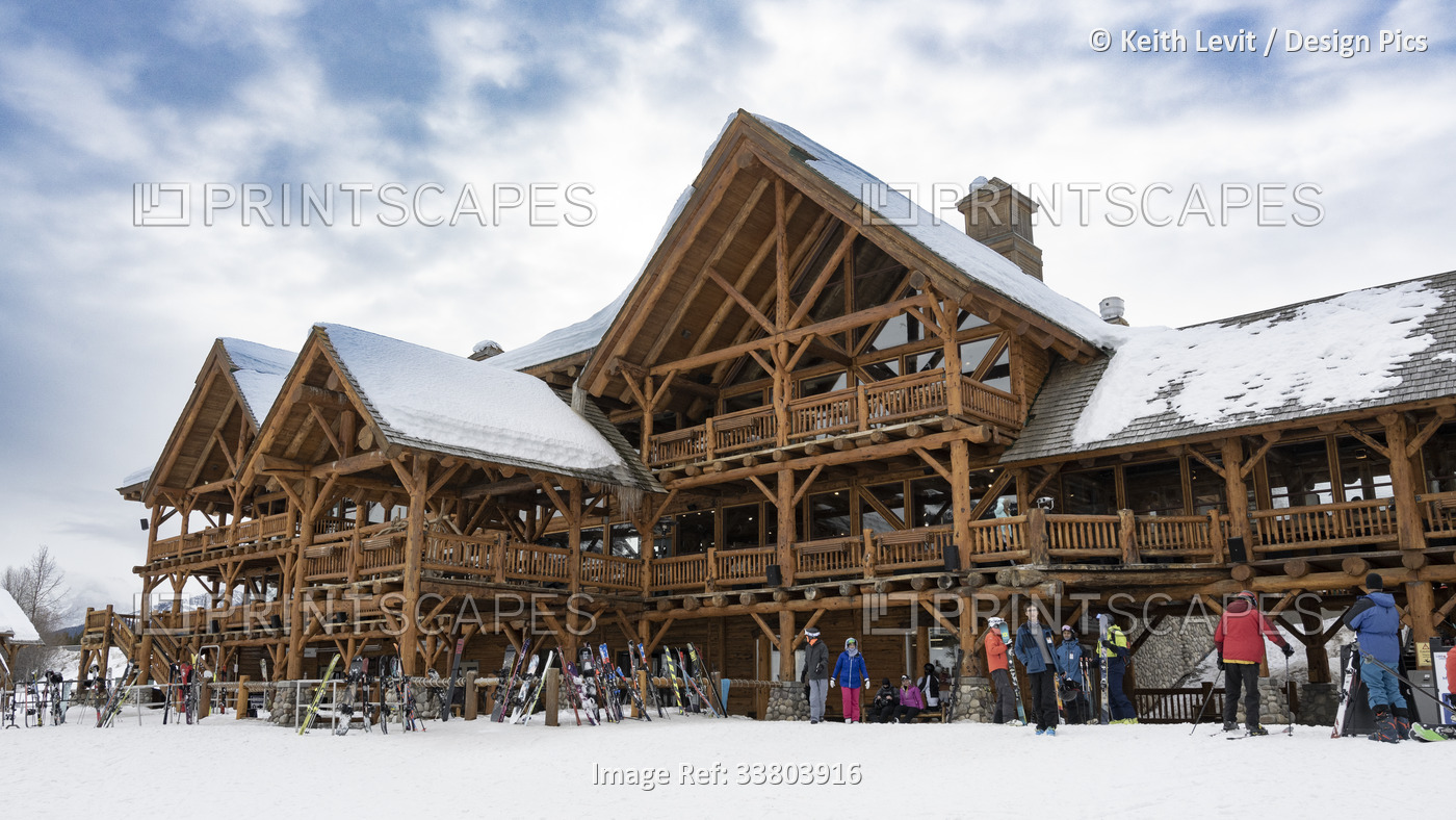 Ski Lodge and skiers at a popular ski resort in Banff National Park; ...
