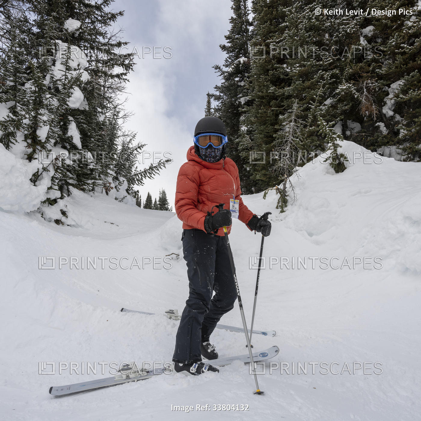Female skier at a ski resort in the Rocky Mountains of Banff National Park, ...