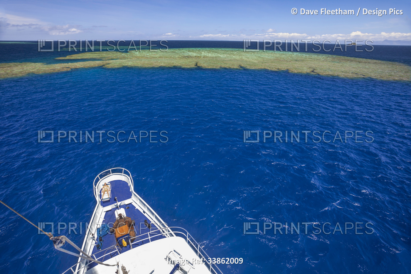 The live-aboard dive boat, Nai'a, anchored off a pinnacle in open ocean in ...