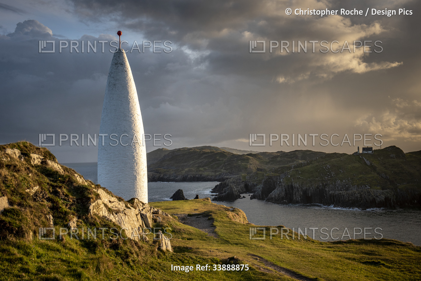 Baltimore Beacon at sunset with Sherkin Island in the background; Baltimore, ...