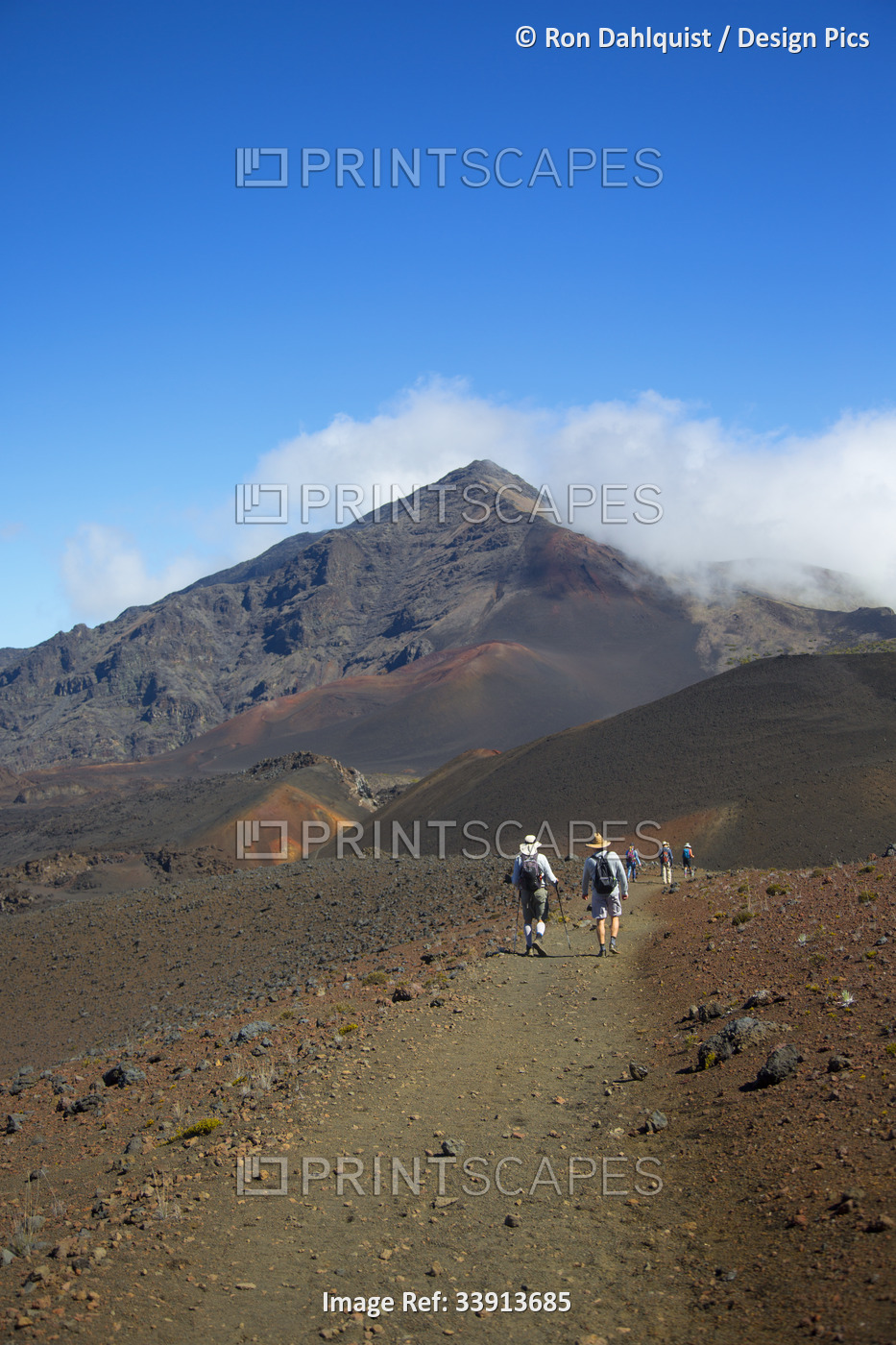 Hikers on Sliding Sands trail in Haleakala Crater, Haleakala National Park; ...