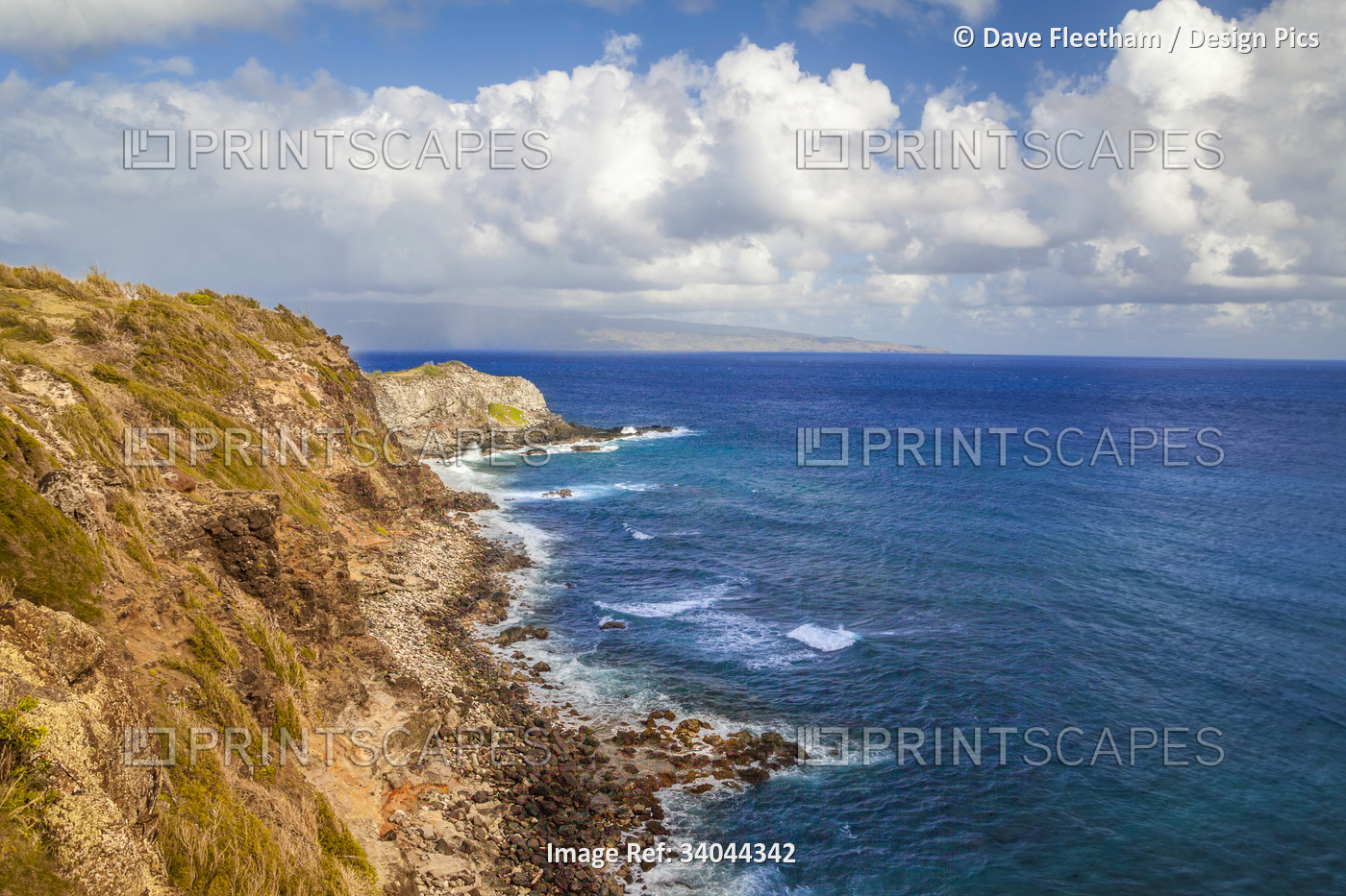 Sea cliffs on the north shore of West Maui, Hawaii with the island of Molokai ...