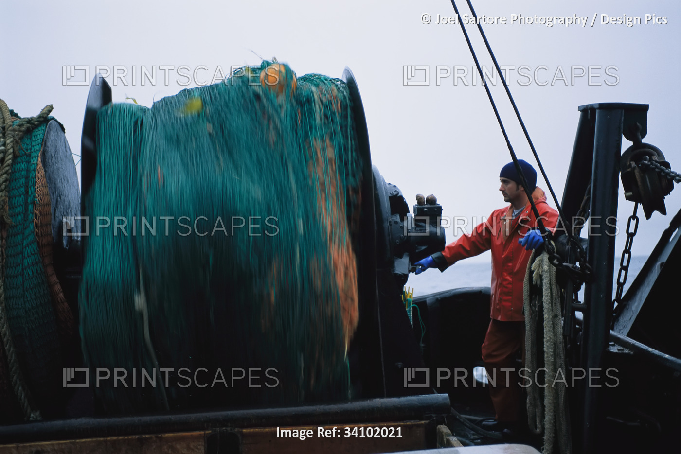Fishing crew with their bottom trawling net in the waters of Clayoquot Sound;  ...