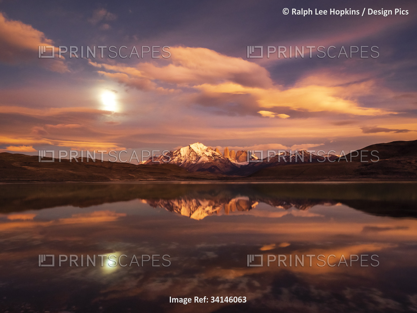 Supermoon reflection at sunrise in Lago Azul, Torres del Paine National Park; ...