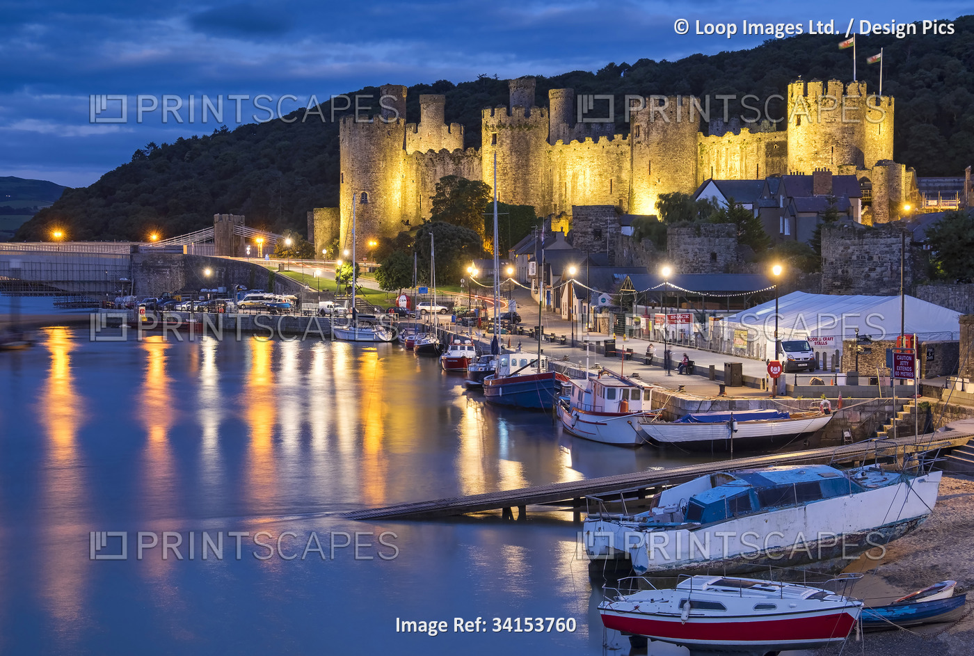 Conwy Castle and Conwy harbour at night.