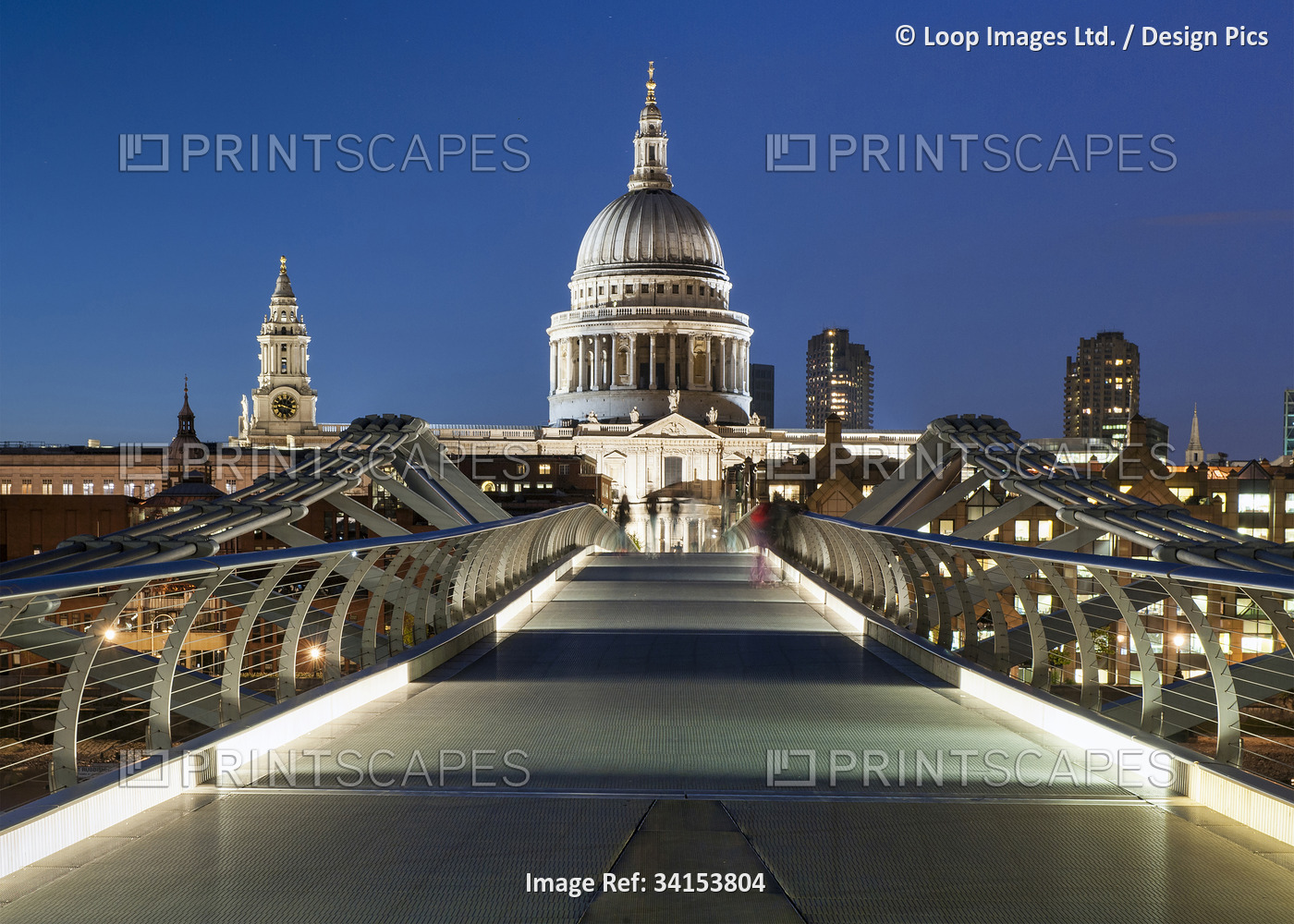 London's Millennium Bridge leading to St Pauls Cathedral at night.