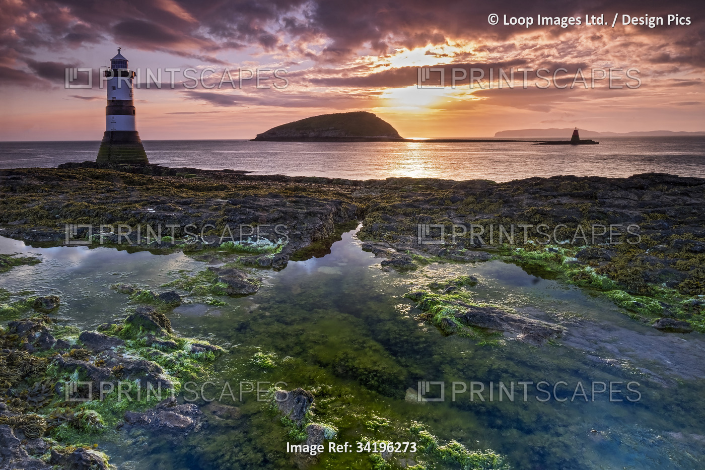 Sunrise over Puffin Island and Trwyn Du Lighthouse on Anglesey.