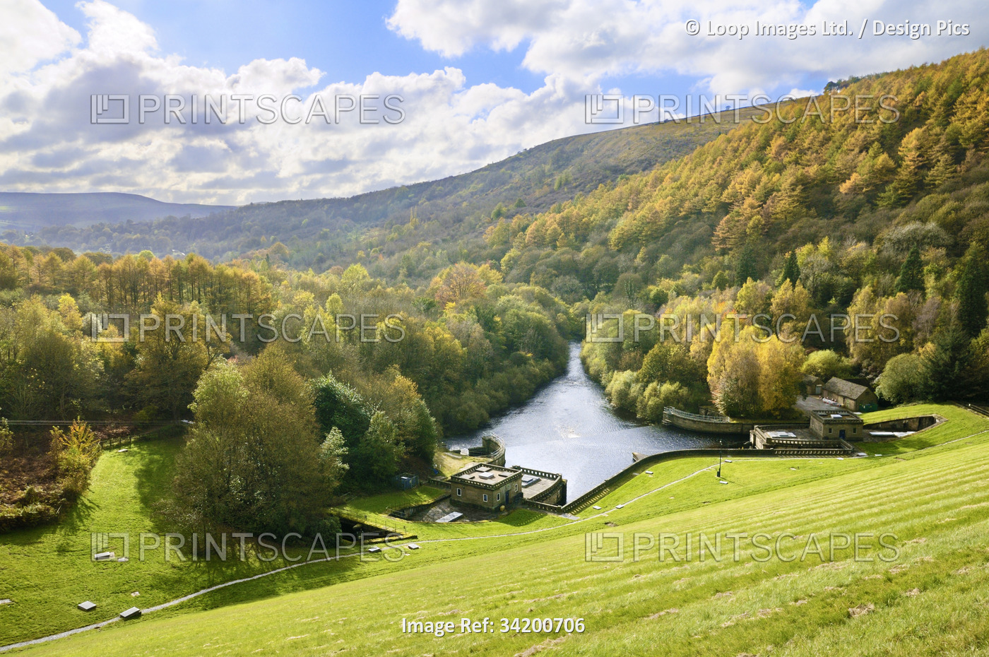 A sunny autumn landscape at Ladybower Reservoir in the Peak District showing ...