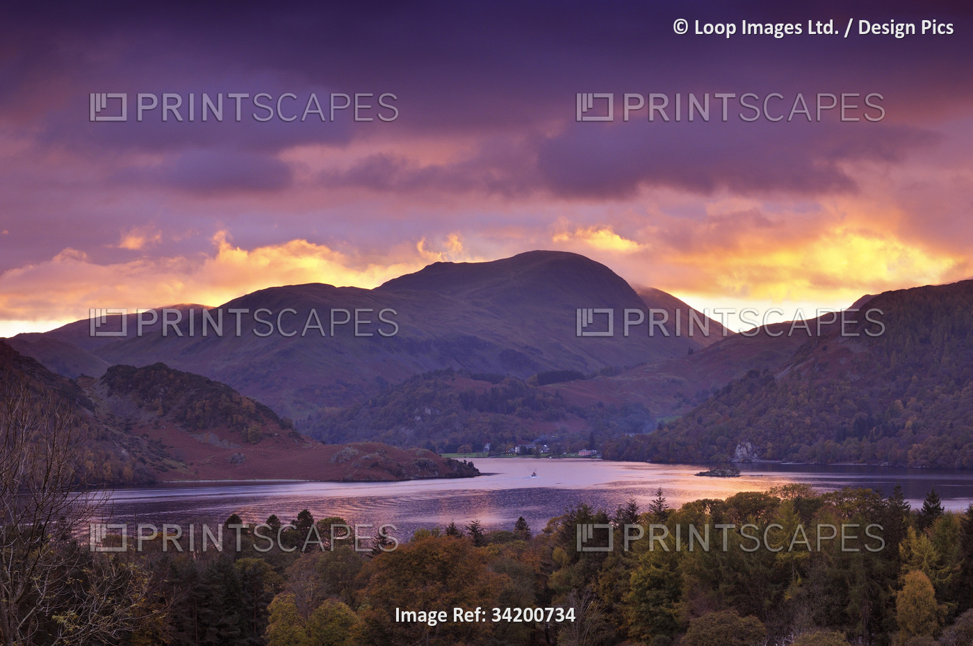 A beautiful autumn view overlooking the lake and fells at Ullswater at sunset ...