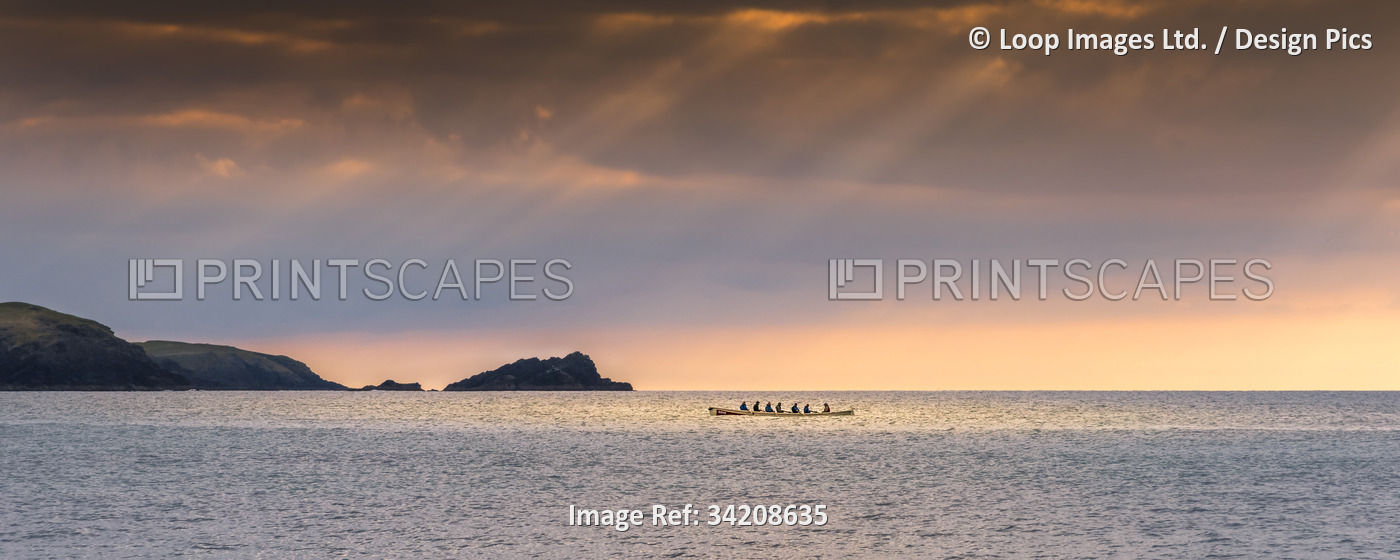 A panoramic image of a traditional historic Cornish Pilot Gig being rowed as ...