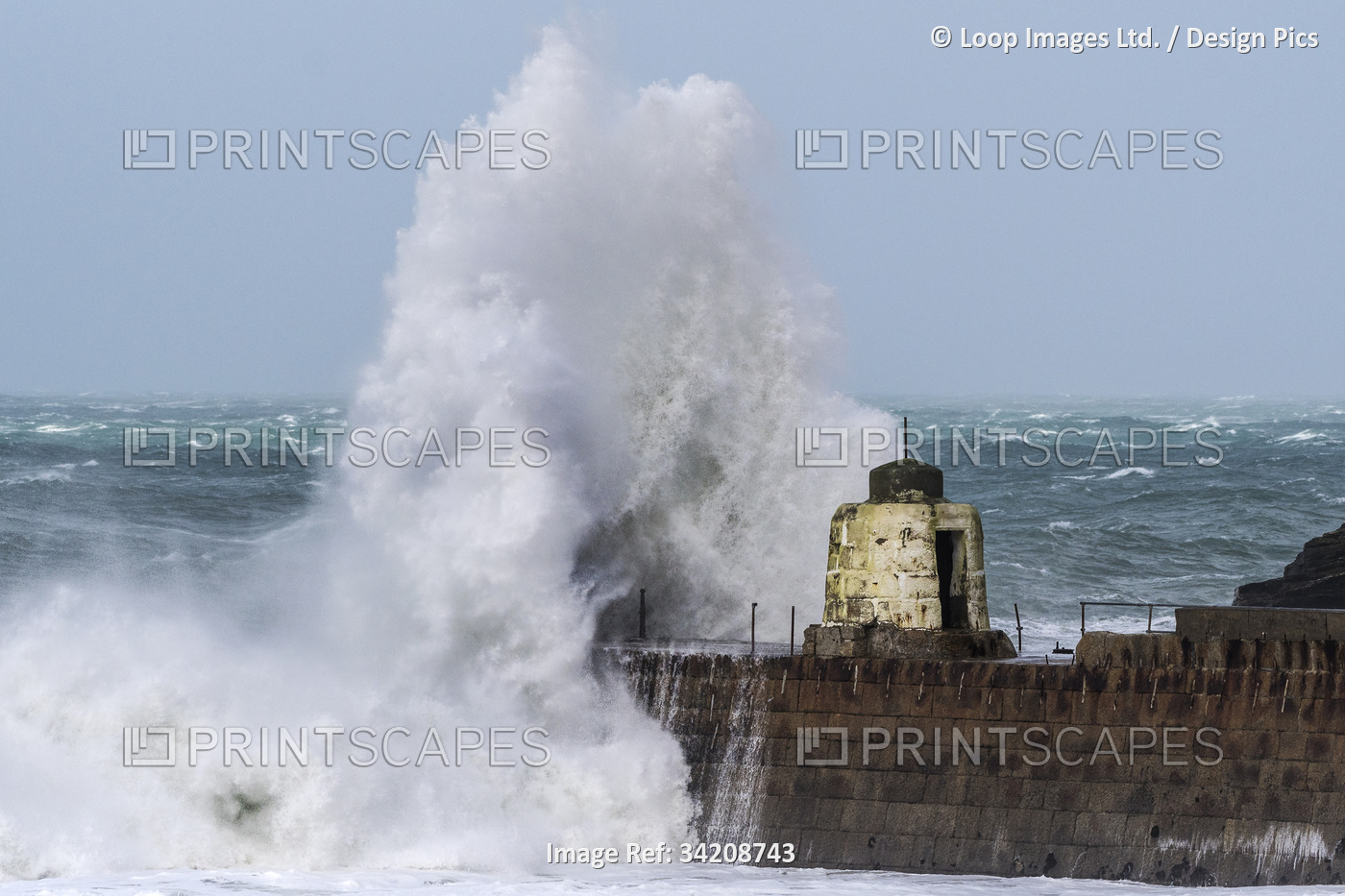 Wild weather battering the Cornish coast with a huge powerful wave breaking ...