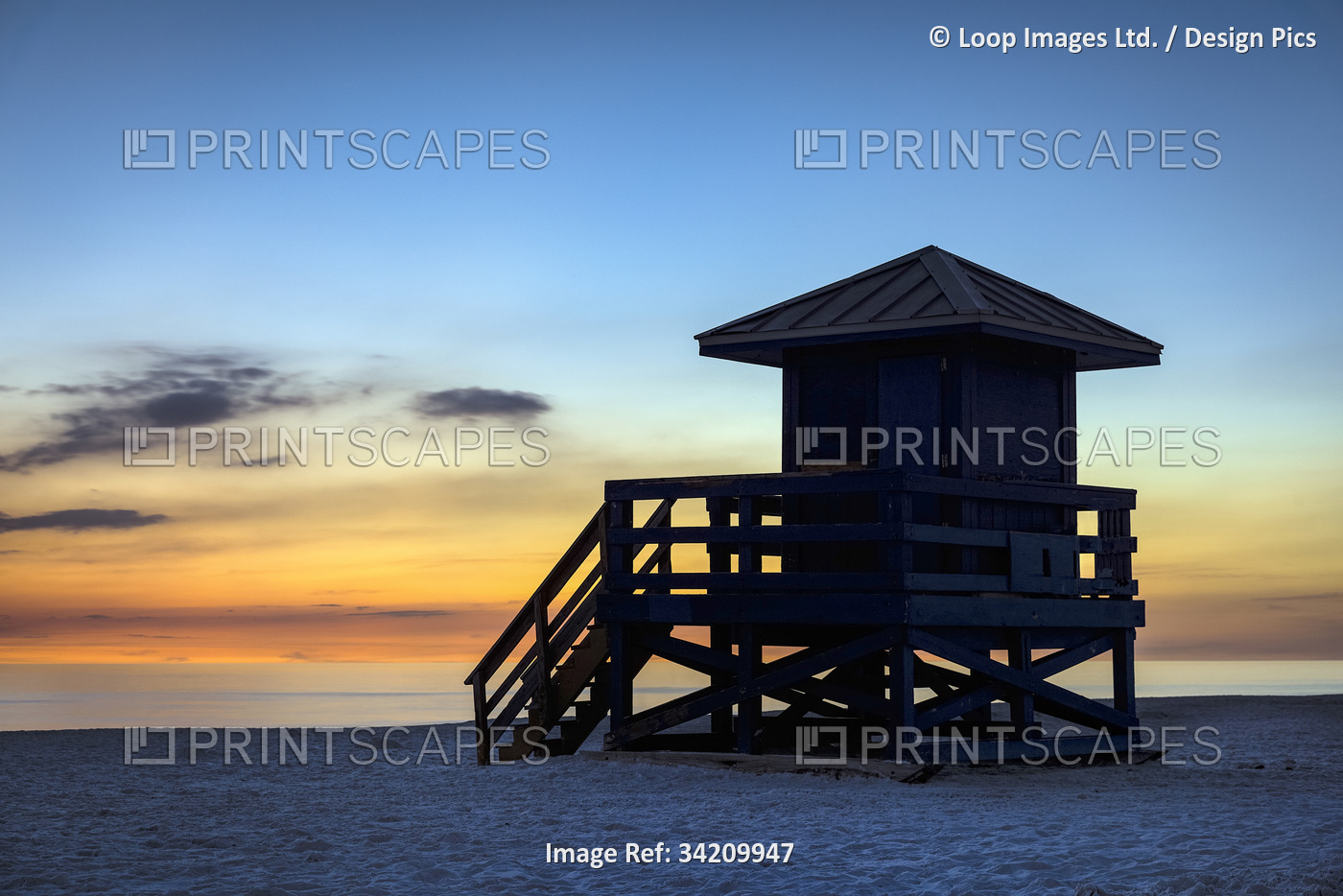 Lifeguard shack at sunset at Siesta Key Beach in Florida.