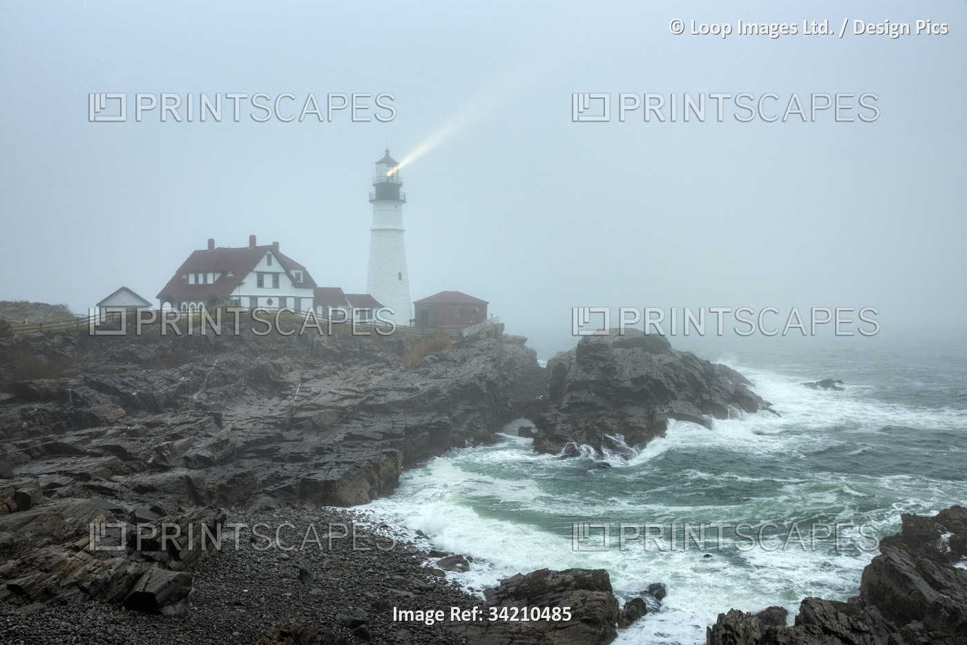 Portland Head Lighthouse in stormy weather.