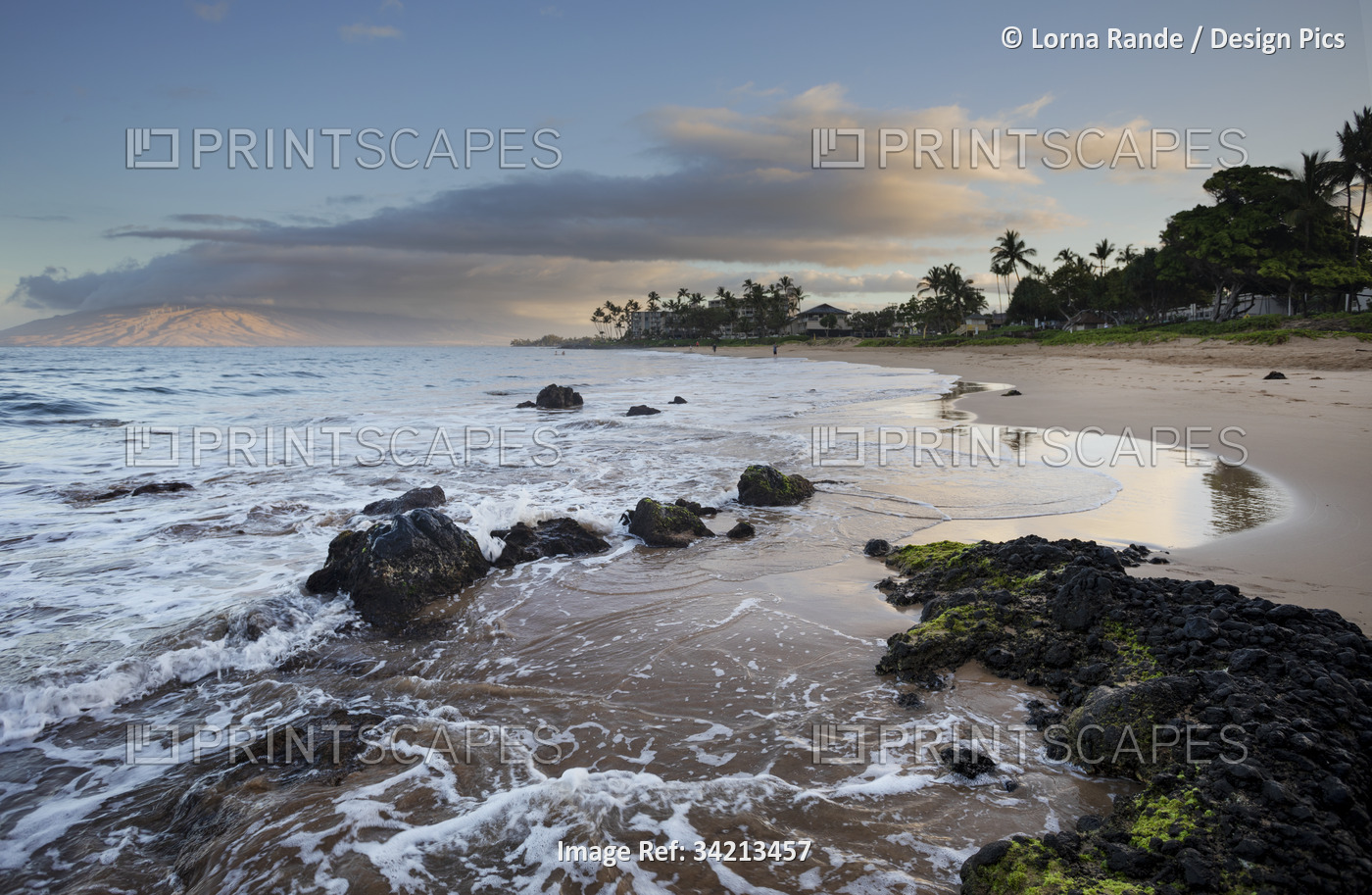 Ocean views and surf on the shore of Kamaole 2 Beach at twilight; Kihei, Maui, ...