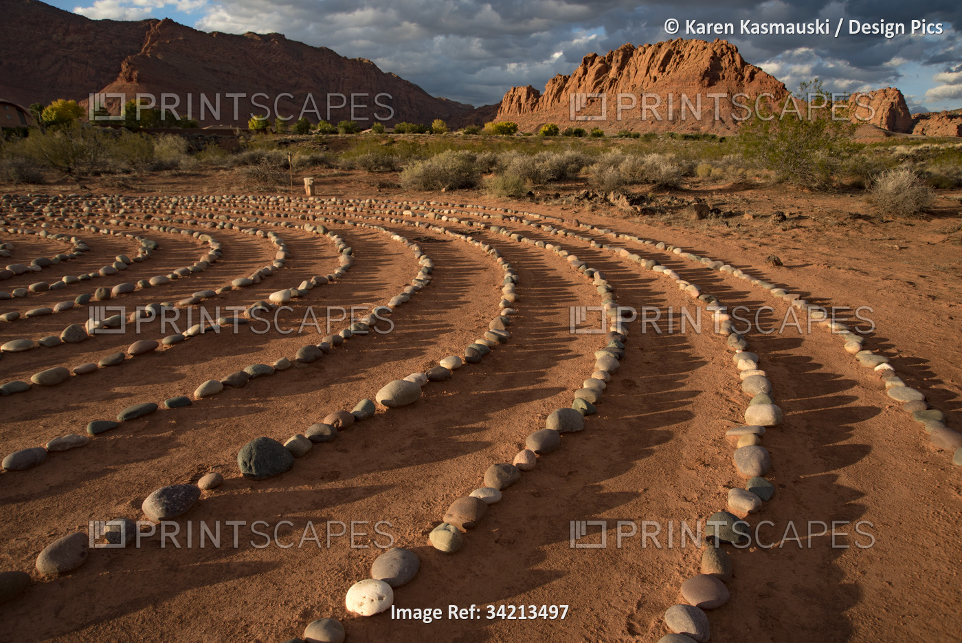 Hiking trail through Snow Canyon, with circles of stones in a meeting area ...