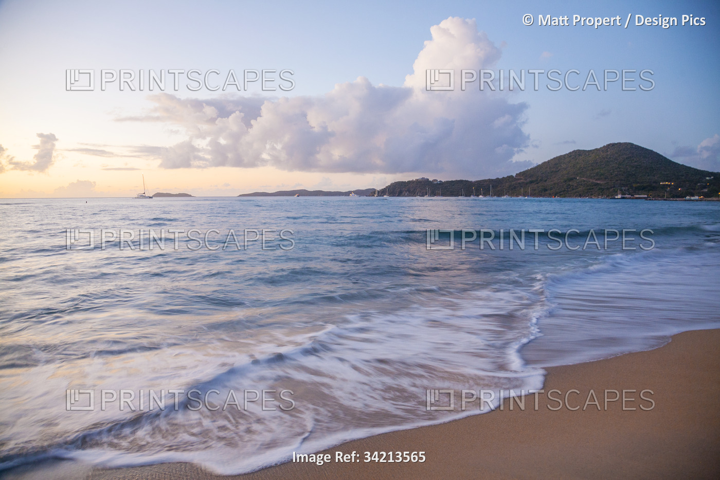 Scenic view of the seaside surf on a beach near the harbor on Virgin Gorda at ...