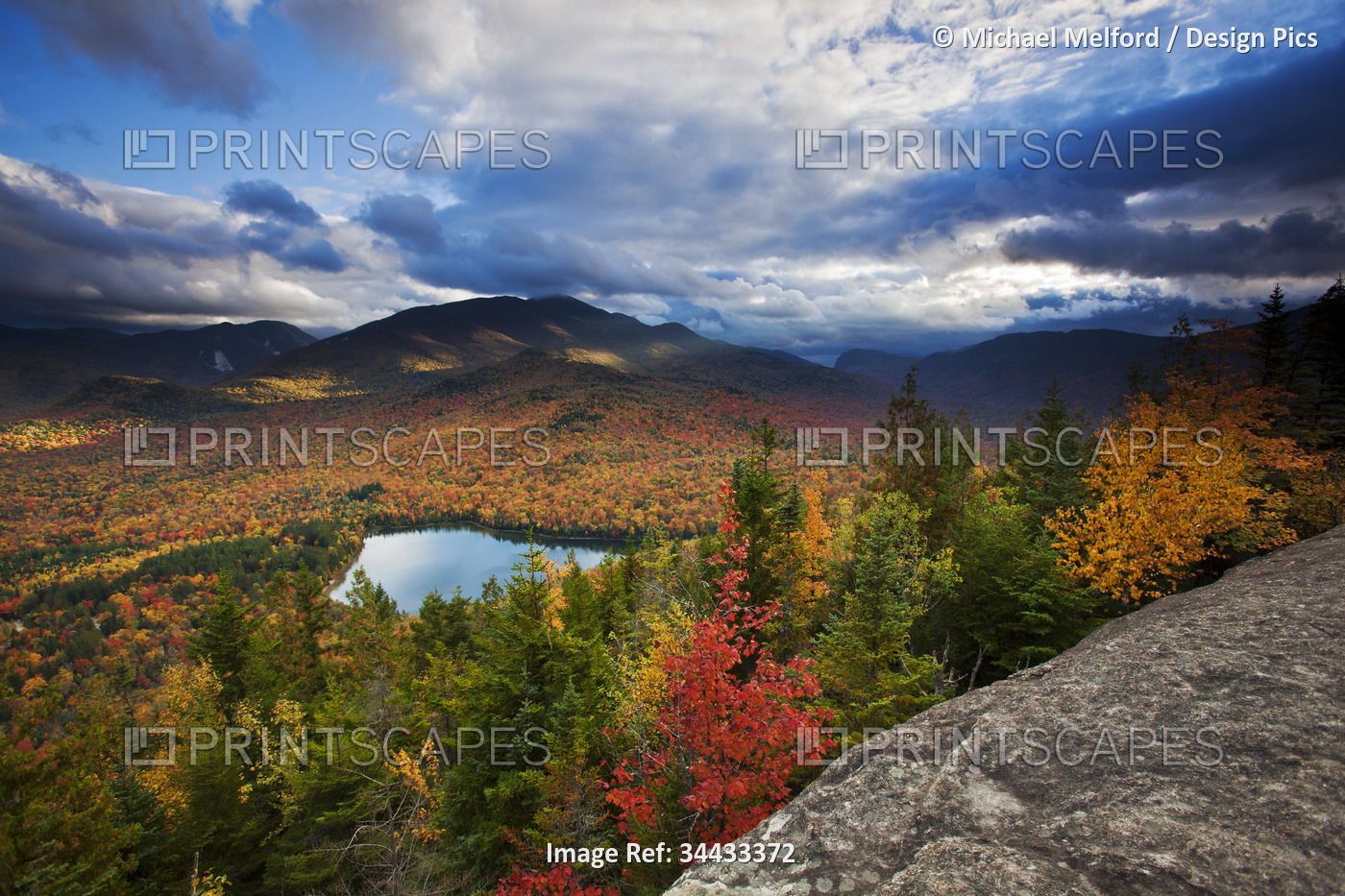 Vibrant autumn colours in Adirondack Park, with a view of Heart Lake and ...