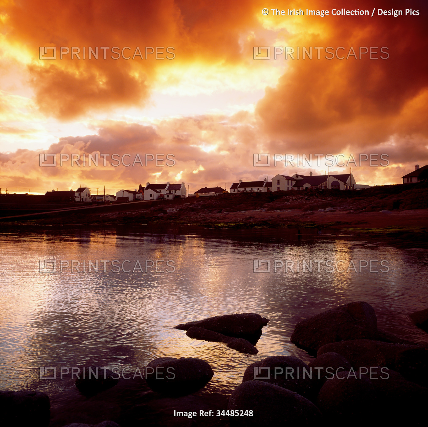 Dramatic sunset clouds over a coastal town in Ireland; Ireland
