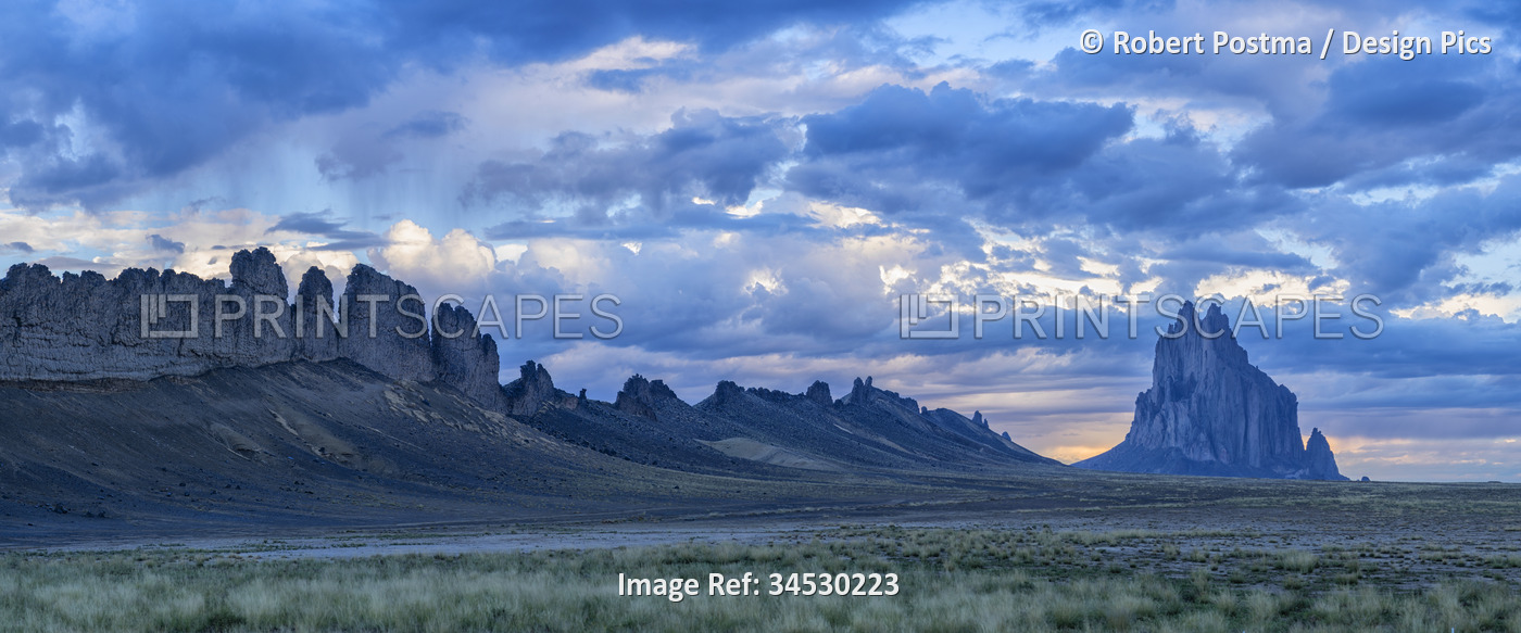 Dramatic storm clouds clear above the rocky ridge and formation of the iconic ...