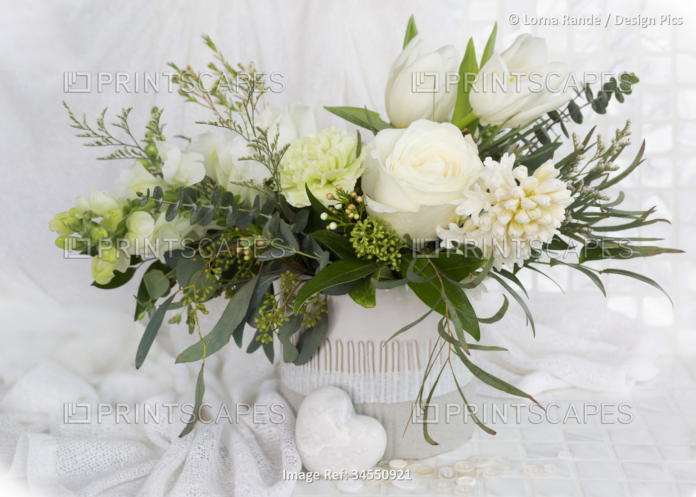 Bouquet of a variety of white flowers on a white background; Studio