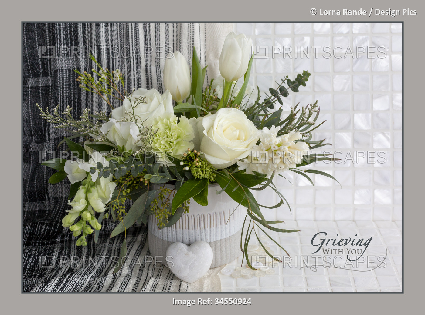 Flower art with a white floral bouquet and caption 'Grieving with you'; Studio