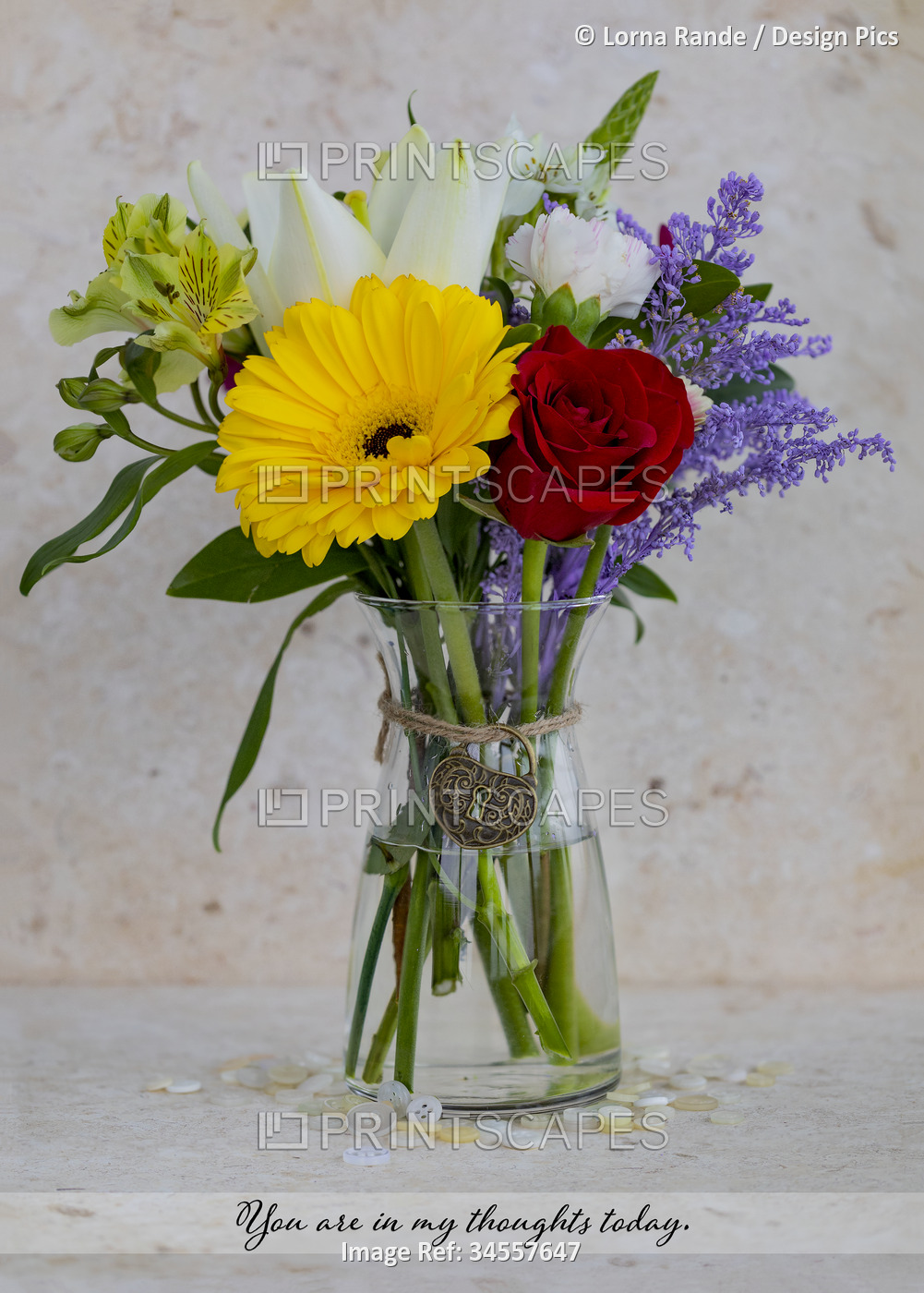 Small, colorful bouquet in a glass vase with a thoughtful message in text and a ...