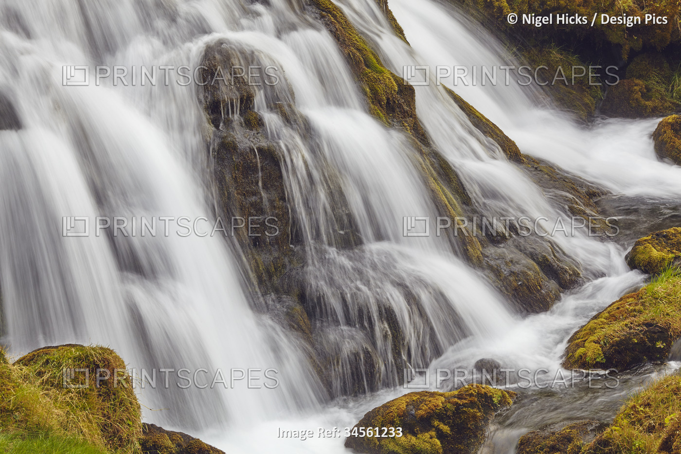 Cascades of the Hafrafell waterfall in mountains near Stykkisholmur, ...