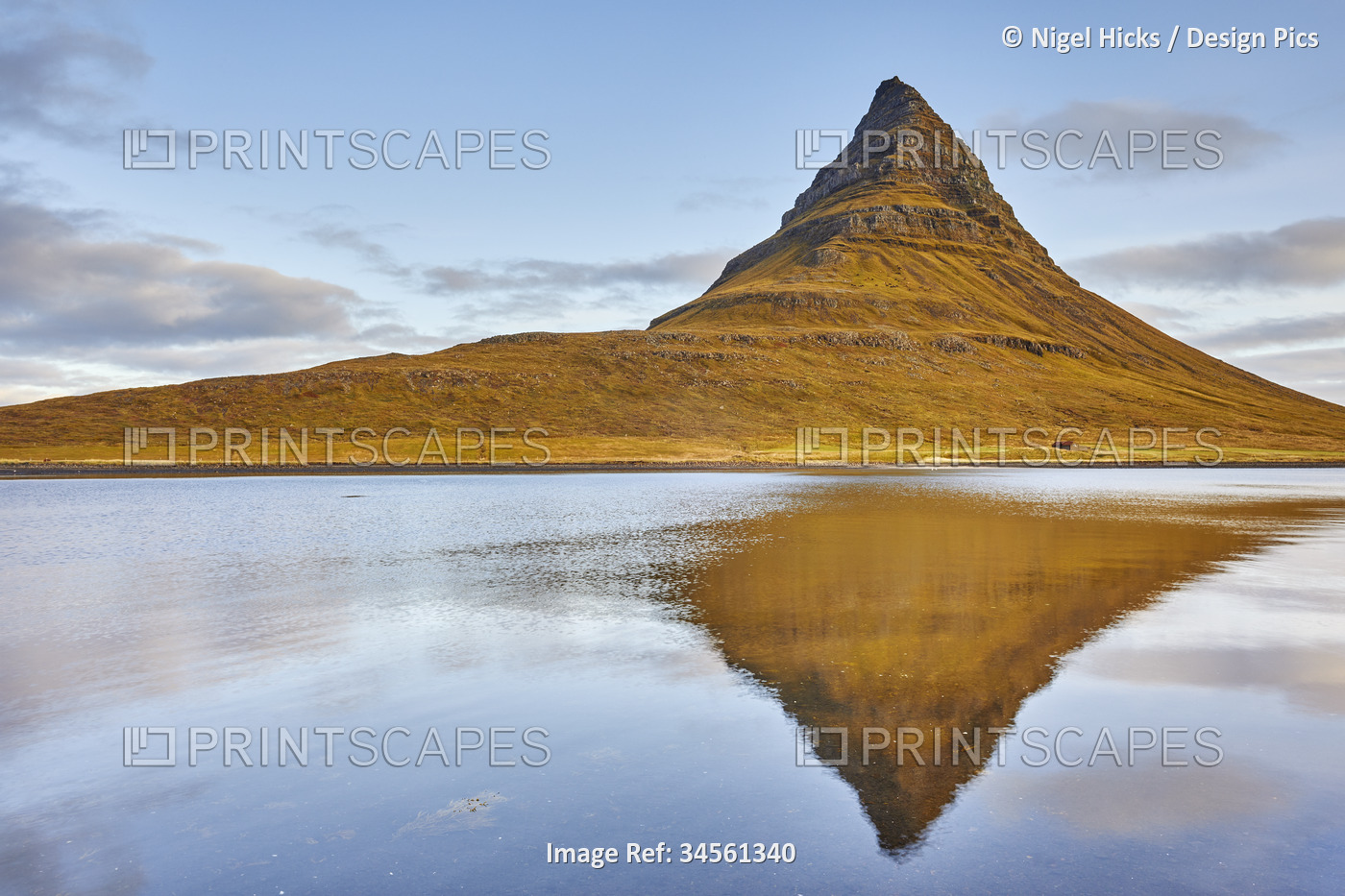 Kirkjufell mountain and it's mirror image in water, near Grundarfjordur, ...