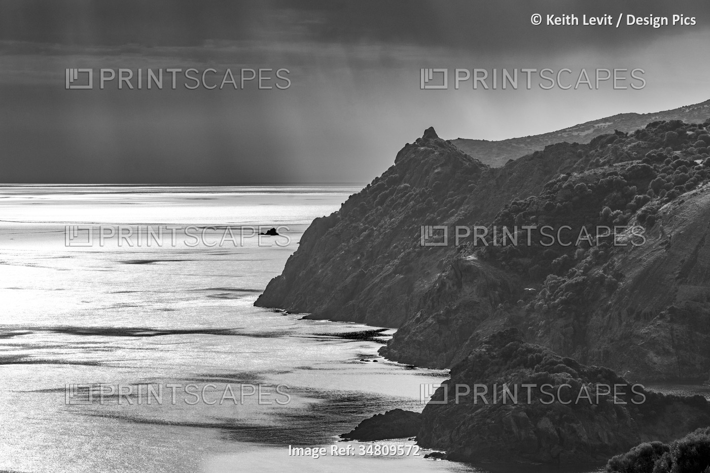 Black and white image of a coastal view of the Sardinian cliffs overlooking the ...